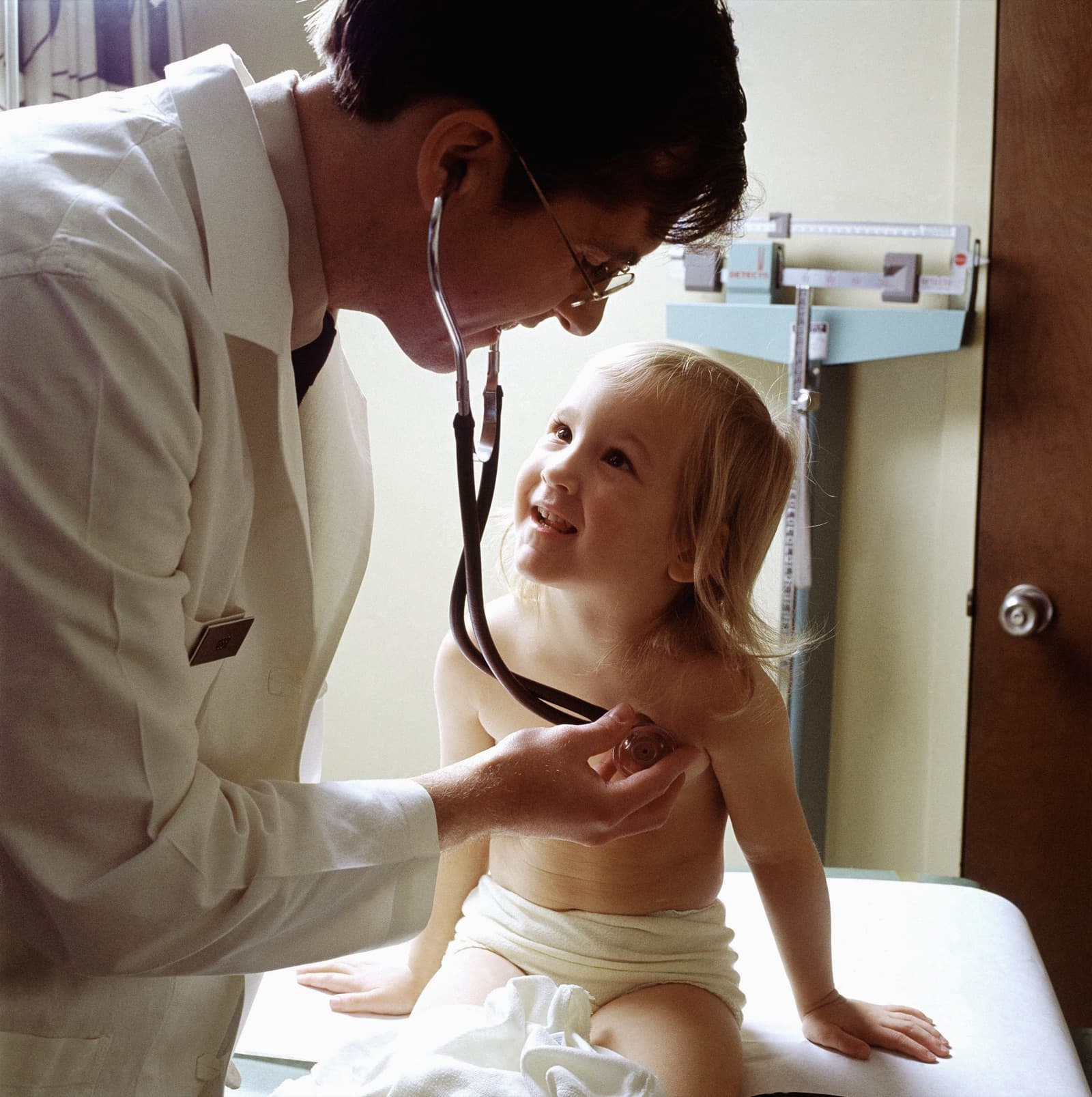 A doctor examining a patient with a stethoscope — representing professional medical consultation